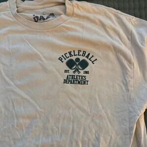 Tan and green pickleball tee